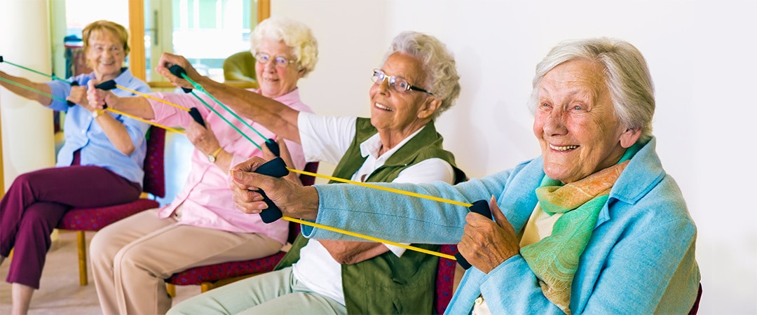 Seniors in a group exercising together.