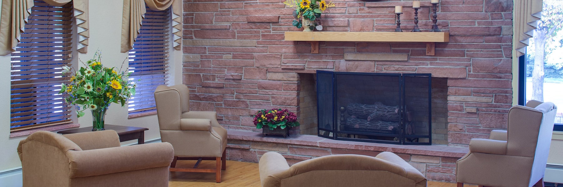 Fireplace and seating in the lobby at Pikes Peak Post Acute