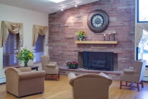Fireplace and seating in the lobby at Pikes Peak Post Acute
